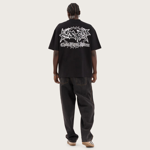 Model wears Wire Street Tee Jet Black T-Shirts in Black - Image 6