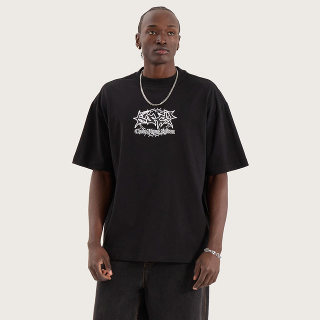 Model wears Wire Street Tee Jet Black T-Shirts in Black - Image 4