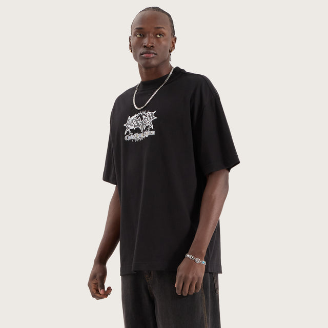 Model wears Wire Street Tee Jet Black T-Shirts in Black - Image 5