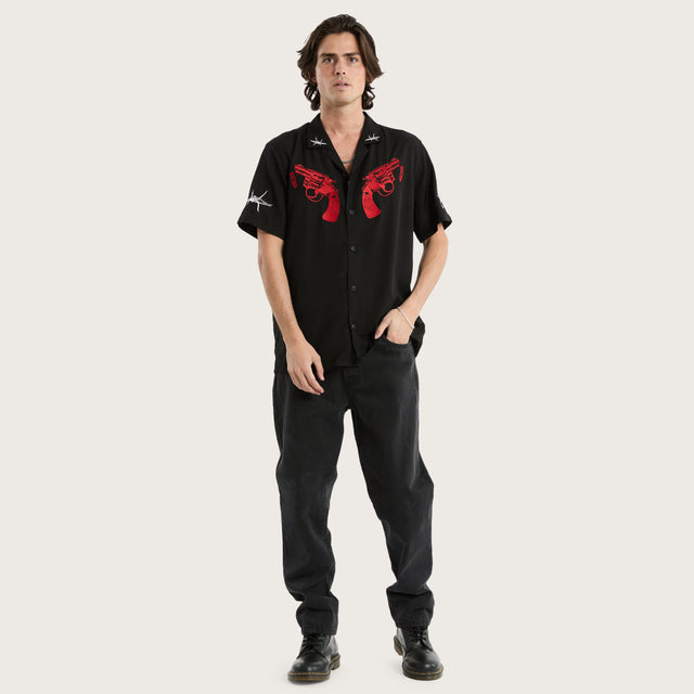 Model wears Revolver Relaxed Resort Shirt Jet Black Short Sleeve Shirts in Black - Image 2