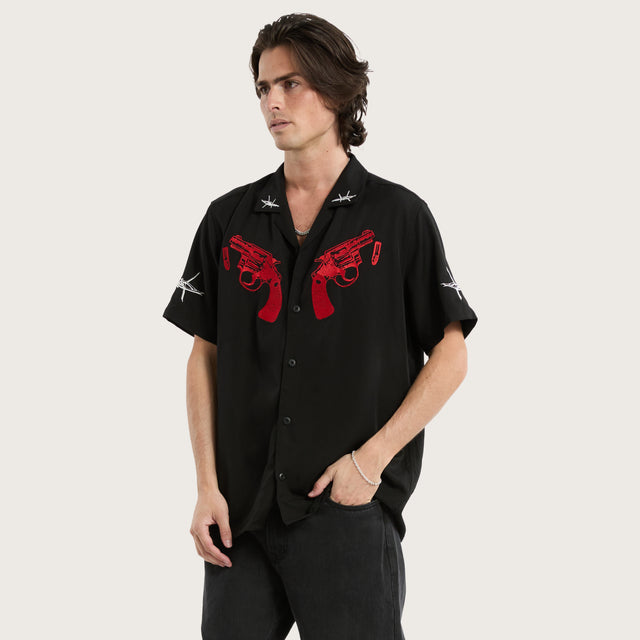 Model wears Revolver Relaxed Resort Shirt Jet Black Short Sleeve Shirts in Black - Image 1