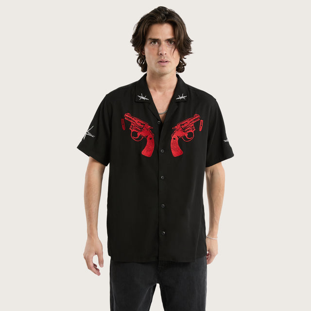 Model wears Revolver Relaxed Resort Shirt Jet Black Short Sleeve Shirts in Black - Image 4