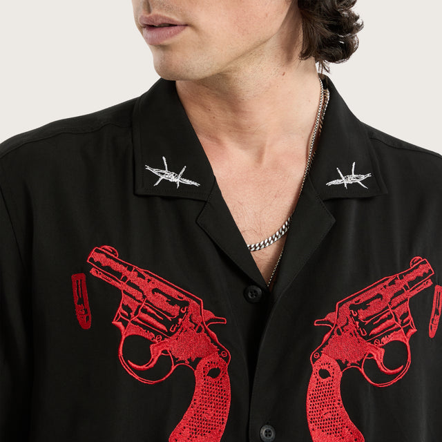 Model wears Revolver Relaxed Resort Shirt Jet Black Short Sleeve Shirts in Black - Image 3