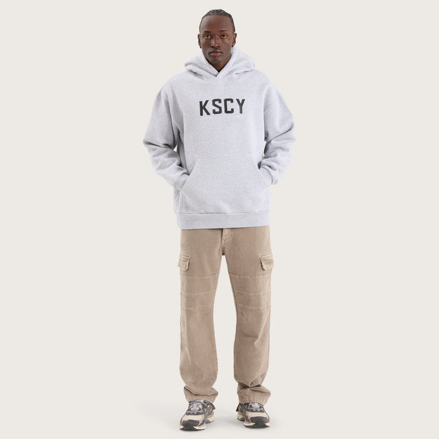 Model wears Paladin Relaxed Hoodie Grey Marle Hoodies in Grey - Image 2