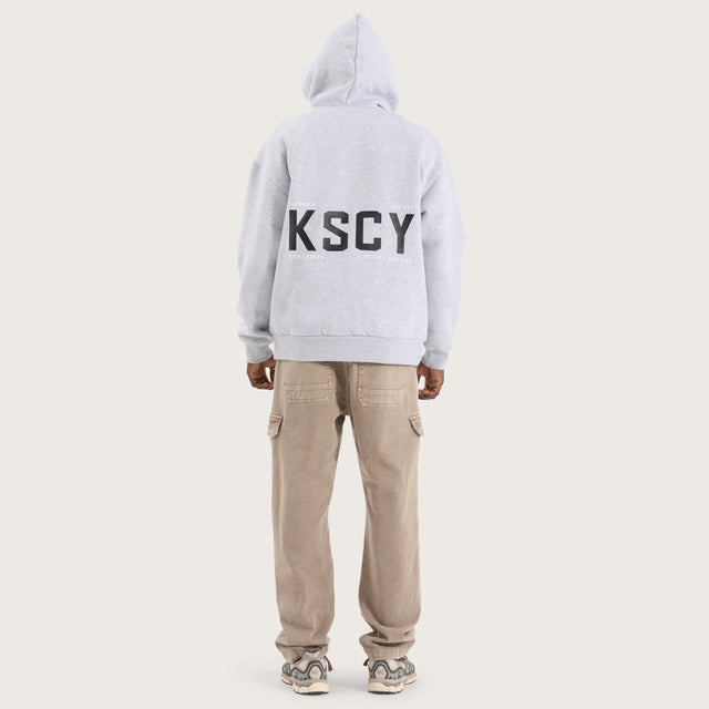 Model wears Paladin Relaxed Hoodie Grey Marle Hoodies in Grey - Image 5