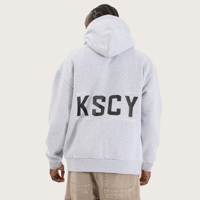 Model wears Paladin Relaxed Hoodie Grey Marle Hoodies in Grey - Image 1
