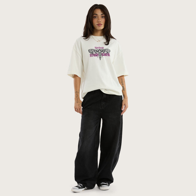 Model wears Desire Street Tee in White T-Shirts in White - Image 7