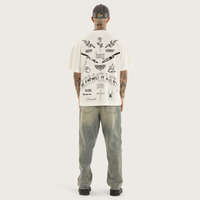 Model wears Sacrifice Street Tee Natural White T-Shirts in White - Image 4