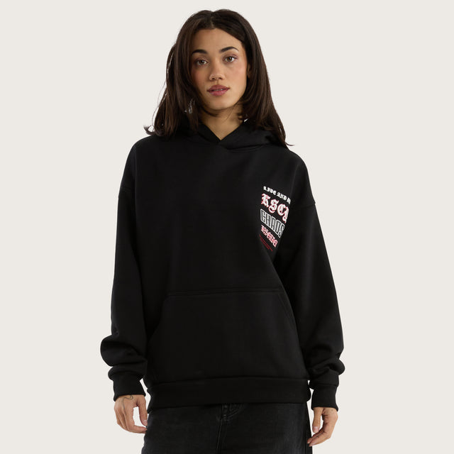 Model wears Trap Oversized Hoodie Jet Black Hoodies in Black - Image 5