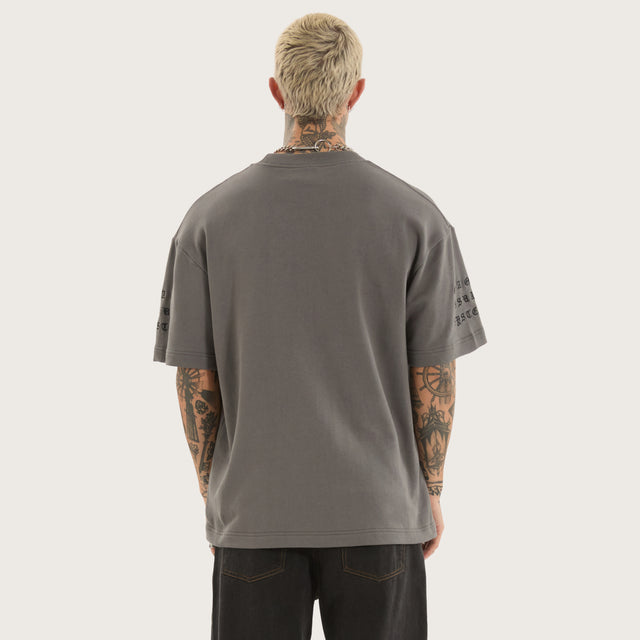 Model wears Repair Loopback Street Tee Charcoal T-Shirts in Grey - Image 4