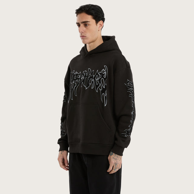 Model wears Scyth Relaxed Hoodie Jet Black Hoodies in Black - Image 6