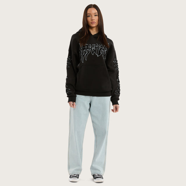 Model wears Scyth Relaxed Hoodie Jet Black Hoodies in Black - Image 3