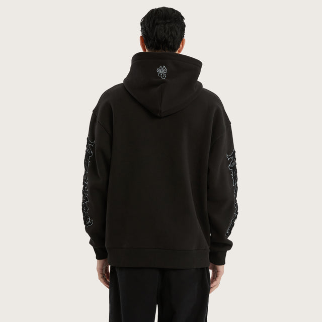Model wears Scyth Relaxed Hoodie Jet Black Hoodies in Black - Image 4