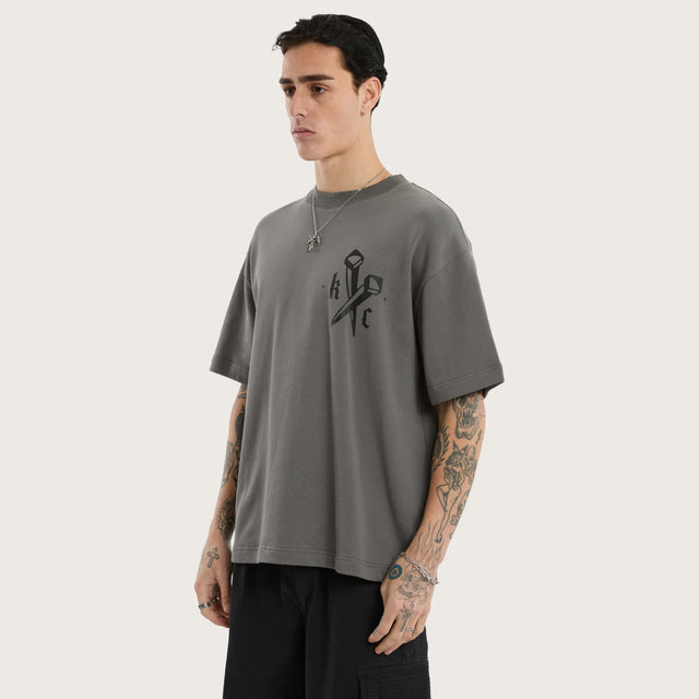 Model wears Nailed Loopback Street Tee Charcoal Grey T-Shirts in Grey - Image 4