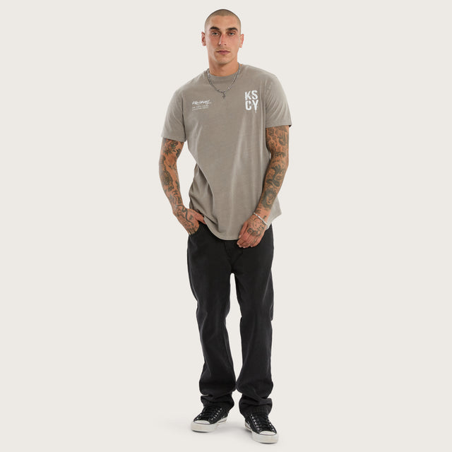 Model wears Alpha Curved Hem Tee Pigment Elephant Grey T-Shirts in Grey - Image 2