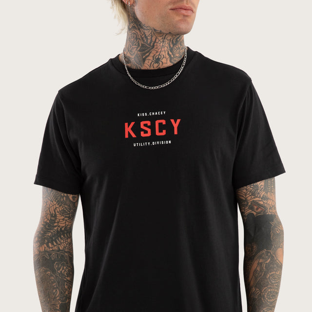Model wears Stamp Curved Hem Tee Jet Black T-Shirts in Black - Image 6