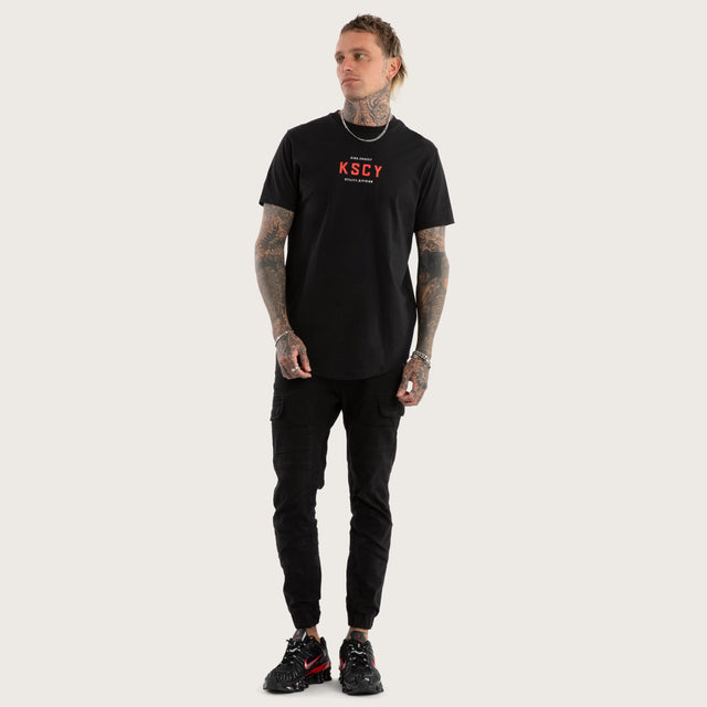 Model wears Stamp Curved Hem Tee Jet Black T-Shirts in Black - Image 2