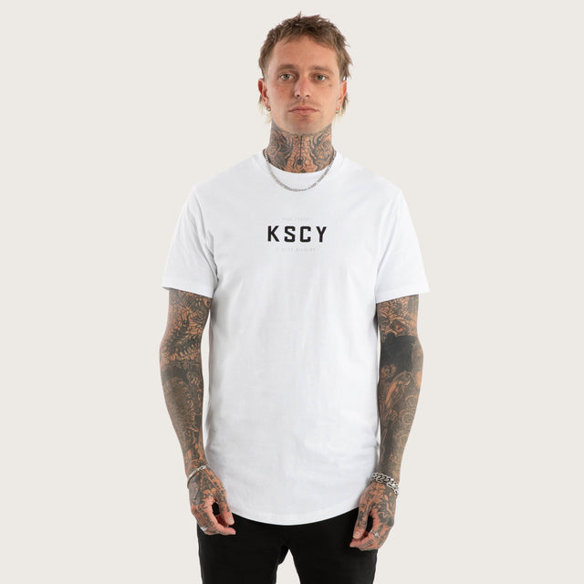Model wears Stamp Curved Hem Tee in Optical White T-Shirts in White - Image 3