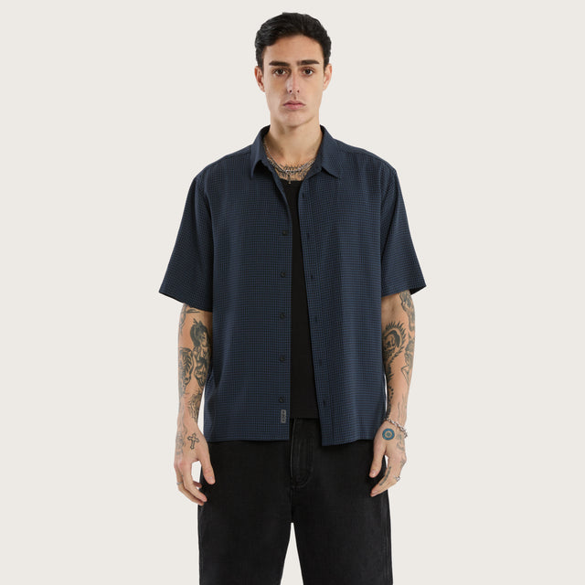 Model wears Longneck Short Sleeve Shirt in Blue Check Short Sleeve Shirts in Blue - Image 1