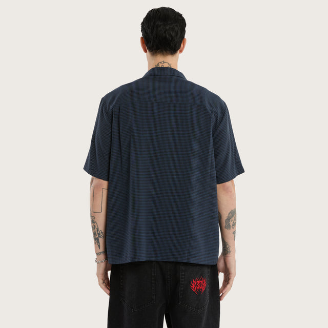 Model wears Longneck Short Sleeve Shirt in Blue Check Short Sleeve Shirts in Blue - Image 2