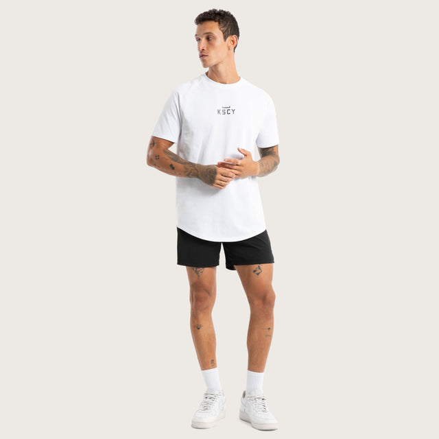 Model wears Endurance Sport Short Jet Black Shorts in Black - Image 2