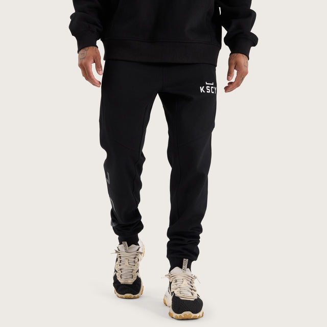 Model wears Flex Track Pant Jet Black Pants in Black - Image 3