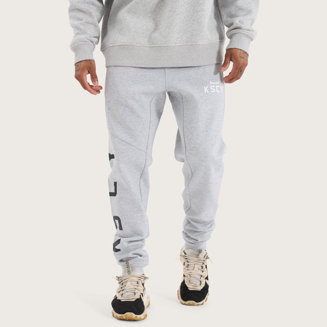 Model wears Flex Track Pant Grey Marle Pants in Grey - Image 2