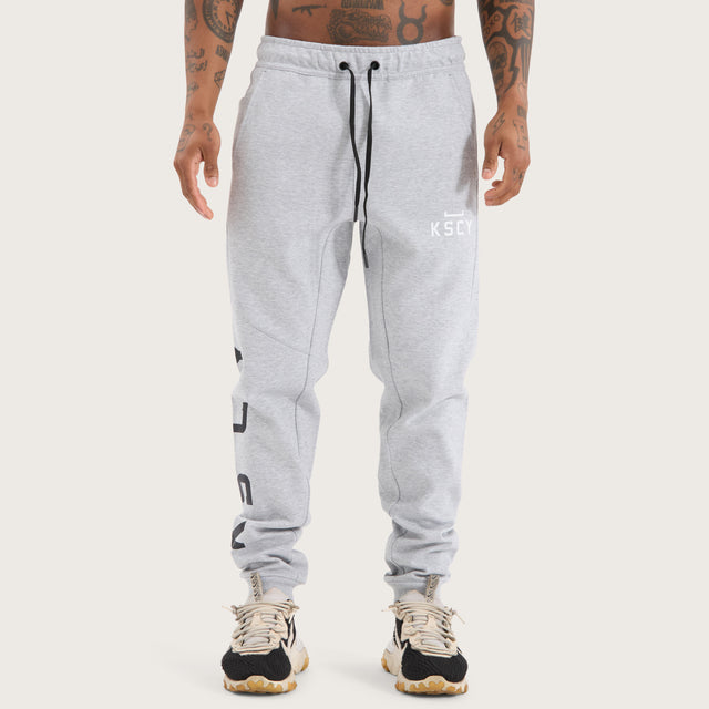 Model wears Flex Track Pant Grey Marle Pants in Grey - Image 7