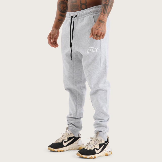 Model wears Flex Track Pant Grey Marle Pants in Grey - Image 8