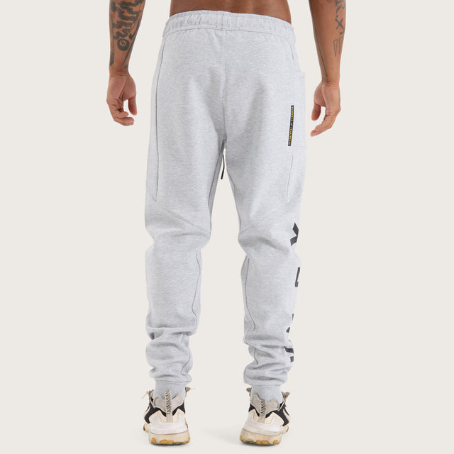 Model wears Flex Track Pant Grey Marle Pants in Grey - Image 9