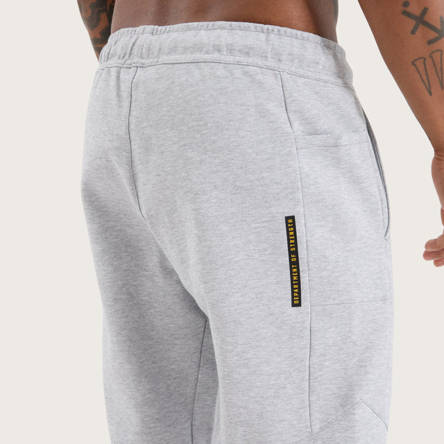 Model wears Flex Track Pant Grey Marle Pants in Grey - Image 5