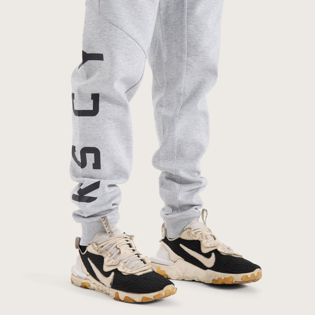 Model wears Flex Track Pant Grey Marle Pants in Grey - Image 4