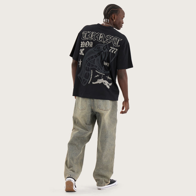 Model wears Trust Street Tee Anthracite T-Shirts in Black - Image 5