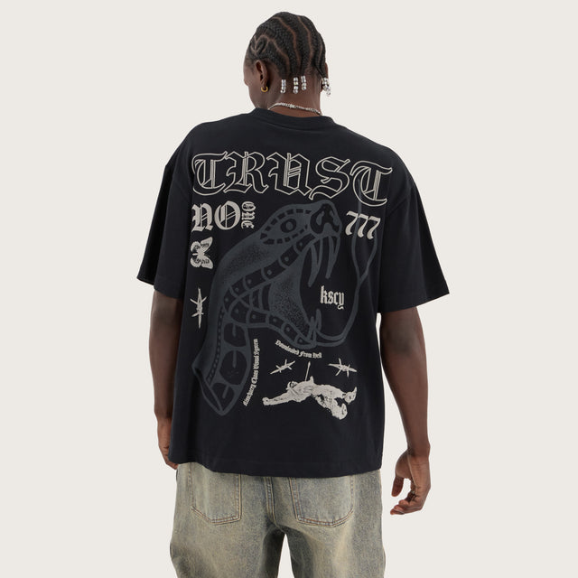 Model wears Trust Street Tee Anthracite T-Shirts in Black - Image 1