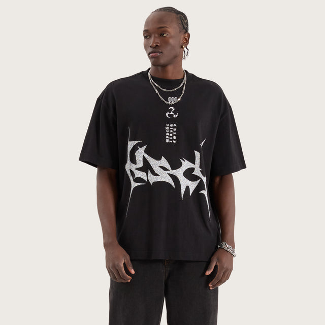 Model wears Gothica Street Tee Jet Black T-Shirts in Black - Image 1