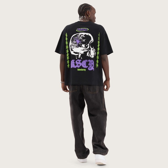 Model wears Disorder Street Tee Anthracite T-Shirts in Black - Image 6