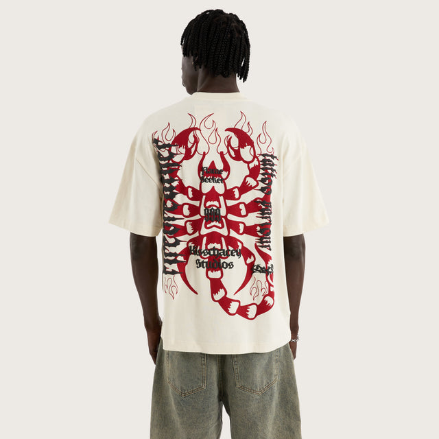 Model wears Firebreather Street Tee Tofu T-Shirts in Off-White - Image 1