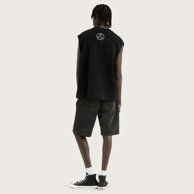 Model wears System Loopback Mechanic Muscle Black Muscle Tees in Black - Image 5