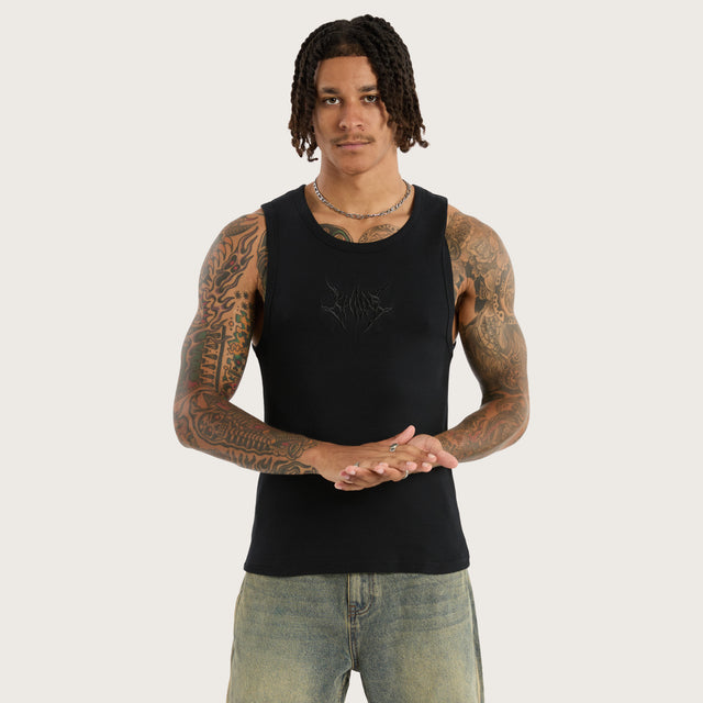 Model wears Chaos Singlet Anthracite Black Tanks in Black - Image 1