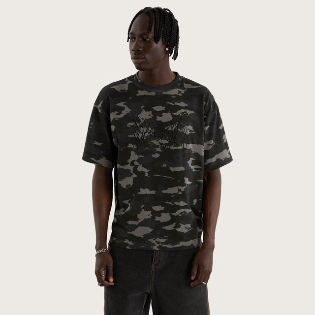 Model wears Camo Street Tee Camo Black T-Shirts in Camo - Image 6
