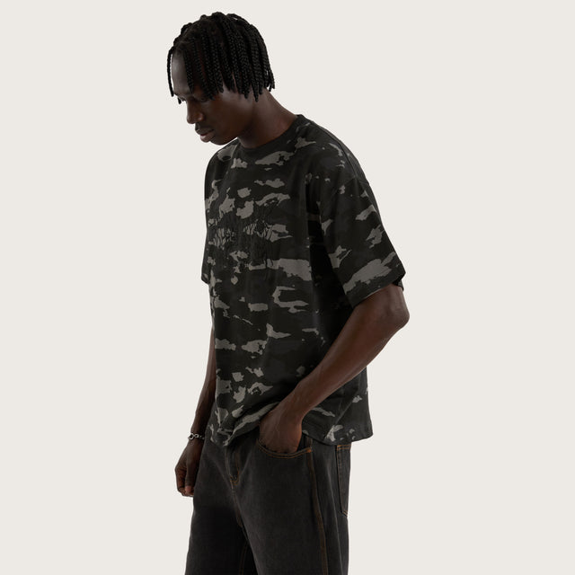 Model wears Camo Street Tee Camo Black T-Shirts in Camo - Image 7
