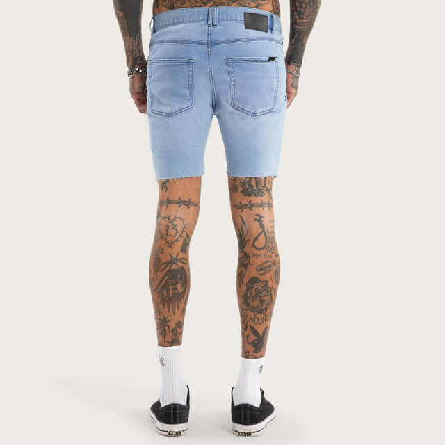 Model wears KS2 Denim Short Destroyed Crystal Blue Shorts in Blue - Image 5