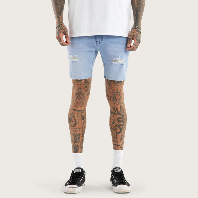 Model wears KS2 Denim Short Destroyed Crystal Blue Shorts in Blue - Image 6