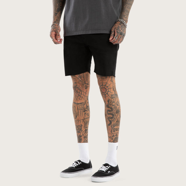 Model wears KS2 Denim Shorts Jet Black Shorts in Black - Image 1