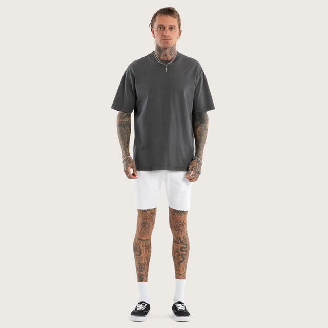 Model wears KS2 Denim Shorts White Shorts in White - Image 2