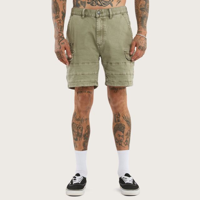 Model wears Salem Cargo Short Vintage Khaki Shorts in Green - Image 3