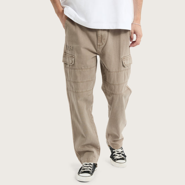 Model wears Seattle Cargo Pant Moon Rock Pants in Brown - Image 1