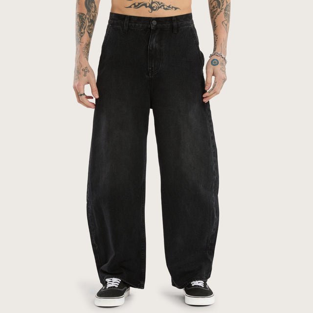 Model wears K8 Balloon Jean Vintage Black Pants in Black - Image 2