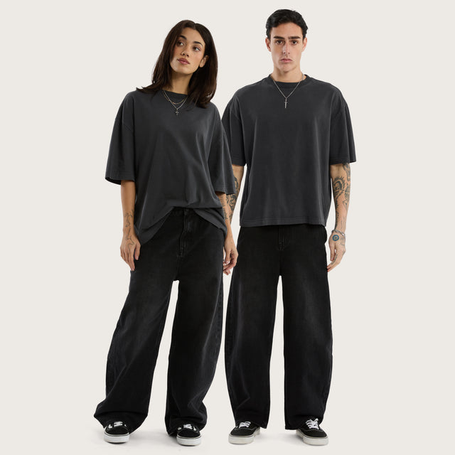 Model wears K8 Balloon Jean Vintage Black Pants in Black - Image 1