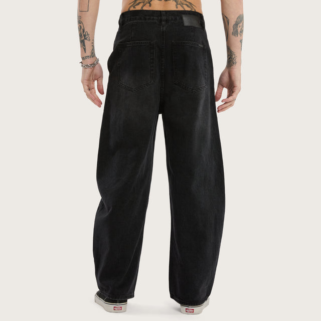 Model wears K8 Balloon Jean Vintage Black Pants in Black - Image 6